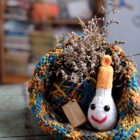 Unique valentine day background with handmade diy, knitted light bulb with meaning as: you turn on my life, a special day for couple, nice idea from knit for feb 14, a happiness dayの写真素材
