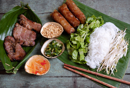 Vietnamese food, spring roll or cha gio, roast meat , a delicious fried food, eat with bun, salad...