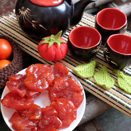 Vietnamese food for Tet holiday in spring, tomato jam, sweet eating is traditional food on lunar new year, can make from tomato cook with sugar,  amazing background for Vietnam customの写真素材