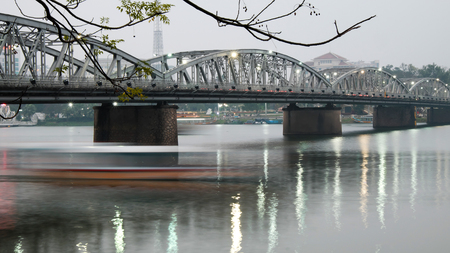 HUE, VIET NAM- FEB 19, 2016: Truong Tien Bridge, cross Huong river, an old bridge link with history, Trang Tien brigde reflect on water, old architect, make from steel, landscape at evening, Vietnamのeditorial素材