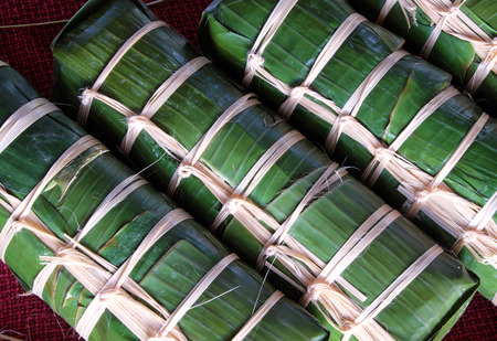Vietnamese food, traditional food on tet holiday in spring, banh tet also name Cylindric glutinous rice cake, make from sticky rice, mung been, cover by banana leaf, tradition eating on lunar new yearの写真素材
