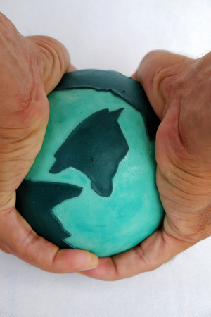 Concept for destroy the earth by human hand on white background, human ruin green planet, is worldwide problem, can make climate change, disaster, damaged environmentの写真素材