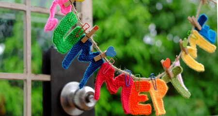 Summer letter hang on rope, summertime background with alphabet on green backgroundの写真素材