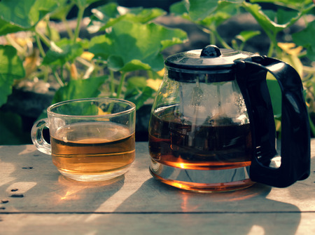 Happy lifestyle with tea pot and cup at garden, relaxation when enjoy a drink at tea timeの写真素材