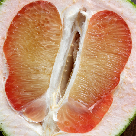 Grapefruit on wood background, tropical fruit, Vietnamese agriculture product, rich vitamin A,...