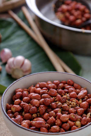 Vietnamese snack food, roasted peanut with red hot pepper, garlic, salt, make delicious eatingの写真素材