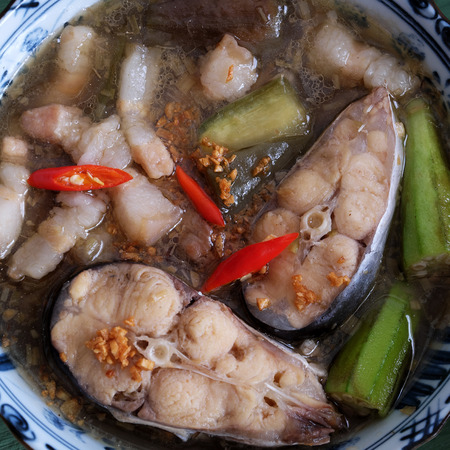 Vietnamese food, mam kho, a featured meal of Mekong Delta, Vietnam. Raw material to cook are basa fish, shrimp, bacon, citronella, garlic, chilli , eat this dish with cooked rice and vegetableの写真素材