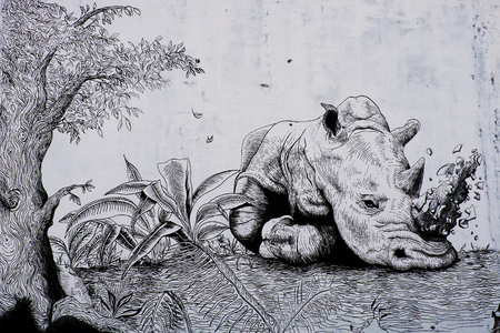 HO CHI MINH CITY, VIET NAM- MARCH 23, 2017: Propaganda campaign to Vietnamese don't use Rhino horn by graffiti art, Rhinoceros painting on wall, message people protect animal, meaningful street artのeditorial素材