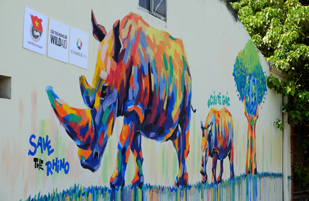 HO CHI MINH CITY, VIET NAM- MARCH 23, 2017: Propaganda campaign to Vietnamese don't use Rhino horn by graffiti art, Rhinoceros painting on wall, message people protect animal, meaningful street artのeditorial素材
