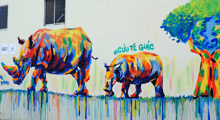 HO CHI MINH CITY, VIET NAM- MARCH 23, 2017: Propaganda campaign to Vietnamese don't use Rhino horn by graffiti art, Rhinoceros painting on wall, message people protect animal, meaningful street artのeditorial素材