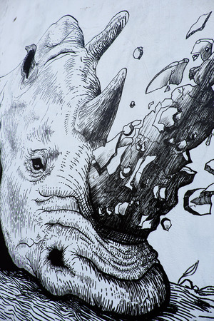 HO CHI MINH CITY, VIET NAM- MARCH 23, 2017: Propaganda campaign to Vietnamese don't use Rhino horn by graffiti art, Rhinoceros painting on wall, message people protect animal, meaningful street artのeditorial素材