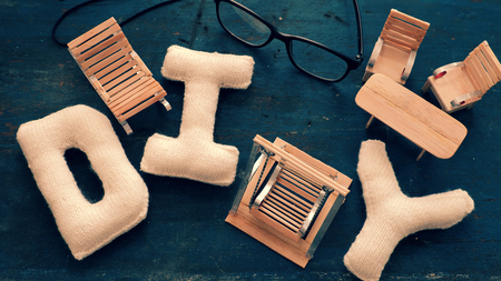 Amazing miniature handmade product for interior design, mini furniture make from wood stick on wooden background, small swing, chair so cute and diy knitted alphabetの写真素材