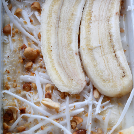 Homemade Vietnam sweet food for dessert, banana cream, raw material to make this eating are ripe banana, coconut milk, peanut, milk, copraの写真素材