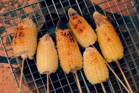 Home food for weekend, grilled corn on coal stove, a delicious, healthy snack food, hot corncob so nutritionの写真素材