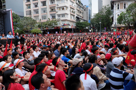 HO CHI MINH CITY, VIET NAM- JAN 27, 2018:  Amazing with large crowd of Vietnamese soccer supporters  watch AFC U23 soccer final match from outdoor Tv screen at Nguyen Hue walking streetのeditorial素材