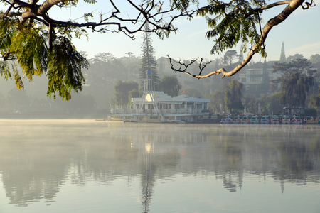 Thuy Ta restaurant of Da Lat city view from branch of flamboyant tree, old and small restaurant also symbol of Dalat that located on Xuan Huong lakeのeditorial素材