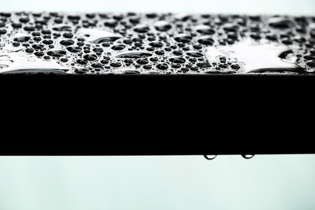 Amazing shape of rain drop on steel surface after rainy day, water drops make abstract nature textureの写真素材