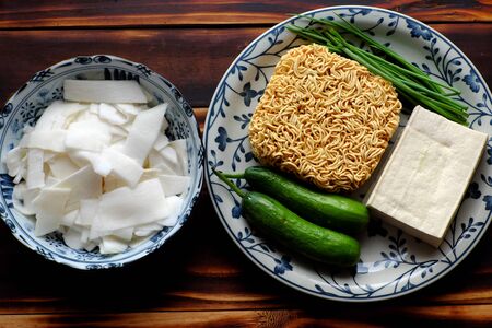 Top view Vietnamese vegetarian food, fried noodles with sour bamboo shoots, cucumber and tofu on...
