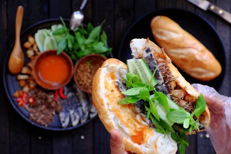 Close up from high view woman hand prepare breakfast, Vietnamese vegan bread stuff with mushroom...