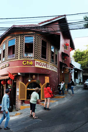 DA LAT, VIETNAM- JAN 27, 2020: Amazing vintage architecture of sweet soup restaurant, a famous place to check in when travel this city with beautiful architect in brown color at bend of slope streetのeditorial素材
