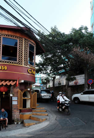 DA LAT, VIETNAM- JAN 27, 2020: Amazing vintage architecture of sweet soup restaurant, a famous place to check in when travel this city with beautiful architect in brown color at bend of slope streetのeditorial素材