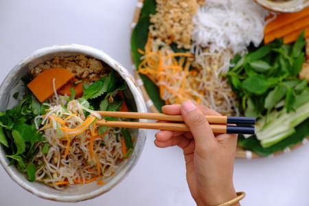 Top view tray of vegetarian food ready to eat, vegan noodles mixing with vegetables as, cucumber,...