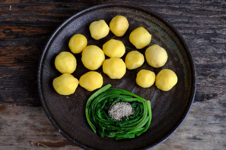 Top view plate of boiled potato for quick vegan meal, healthy food rich starchの写真素材