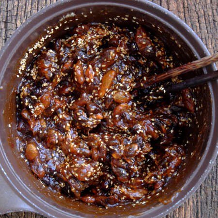 Raw material for homemade food, tamarind paste cook with sugar and sesame to make delicious snacks food, ripe tamarinds rich vitamin can make sauce for many dishの写真素材