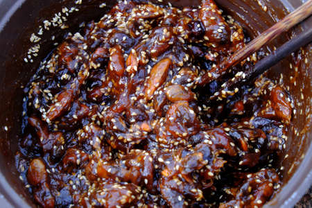 Raw material for homemade food, tamarind paste cook with sugar and sesame to make delicious snacks food, ripe tamarinds rich vitamin can make sauce for many dishの写真素材