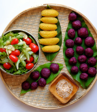 Top view tray of vegan food from violet sweet potato, boiled banana and salad with tomato for simple dinner, a non meat menu will good for healthの写真素材