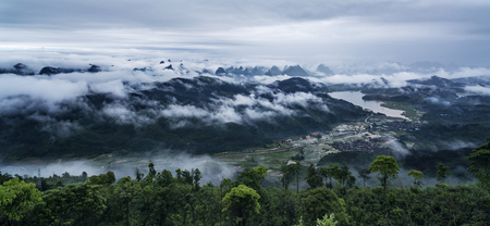 mountain peak in fog sceneryの写真素材