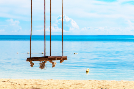 wooden swing at beach sideの写真素材