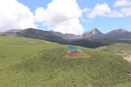 Tibetan prayer flags on a mountainの写真素材