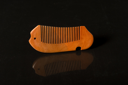 comb isolated on dark background