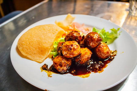 Spicy fried pork ball with Sauce , Cornflakes and Vegetableの写真素材