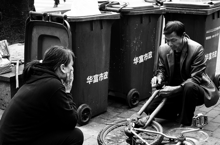 Repairing the bikeのeditorial素材