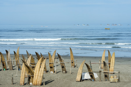 Traditional Peruvian small Reed Boats (Caballitos de Totora), straw boats still used by local fishermens in Peruの写真素材