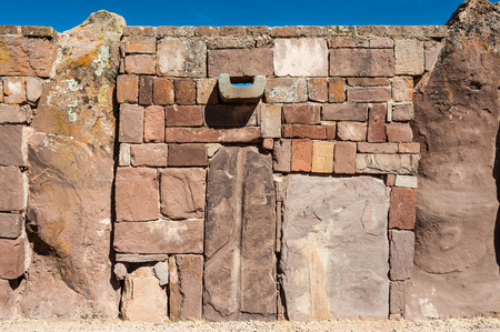 TIWANAKU, JULY 29: Wall at Tiwanaku - ancient city near the Lake Titicaca 12-17 BC. - july 29 2011 in Tiwanaku, Titicaca region, Altiplano, Boliviaの写真素材