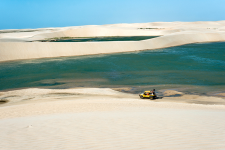 Jericoacoara, Ceara state, Brazil - July 2016: Buggy with tourists traveling through the desert Jericoacoara National Parkの素材 [FY31062738159]