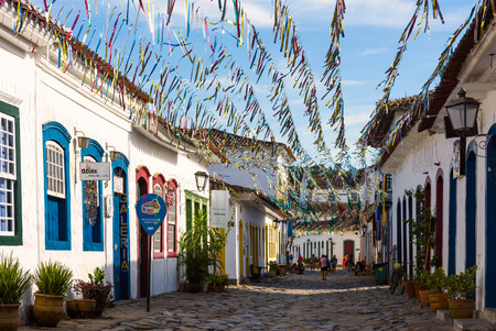 Paraty, Brazil - February 24, 2017: Typical cobblestone street with colonial buildings in historic town Paraty on the time of Carnival, Brazilのeditorial素材