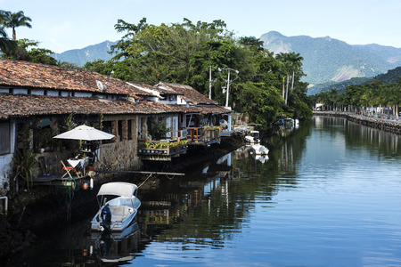 Paraty, Brazil - February 24, 2017: An iconic view of the canal and the colonial houses of the historic town Paraty, Rio de Janeiro state, Brazilの写真素材