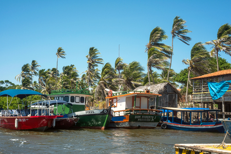 BARREIRINHAS, BRAZIL - 14 JULY 2016: Fishing boats are waiting for a tide near the Cabure lighthouse in Lencois National Parkのeditorial素材