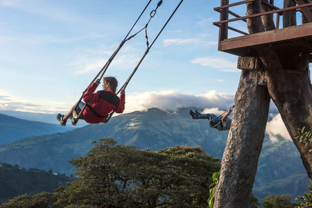 Banos, Ecuador - November 22, 2017: The Swing At The End Of The World Located At Casa Del Arbol, The Tree House In Banos De Aqua Santa, Ecuador, South Americaのeditorial素材