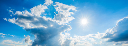 blue sky with clouds and sunの写真素材