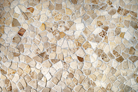 Wall of uneven stones as a backgroundの写真素材