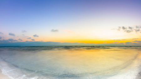 Sunrise at the ocean as a backgroundの写真素材