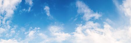 White clouds on a blue sky as background