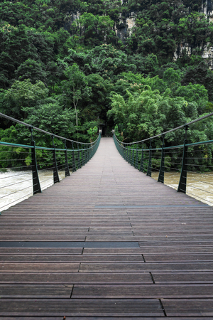 Suspension bridge over the Huangguoshu Great Falls Riverの写真素材