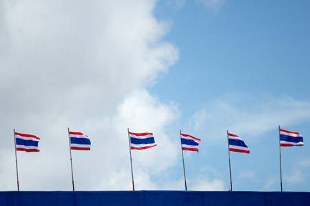 Many Thailand flag with blue sky and some cloud on the background.