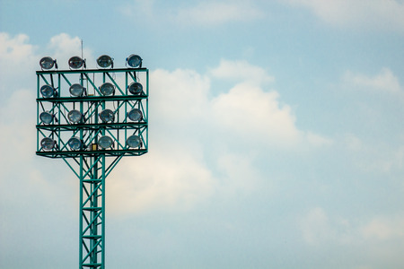 Spotlight at football stadium with blue sky background.の写真素材